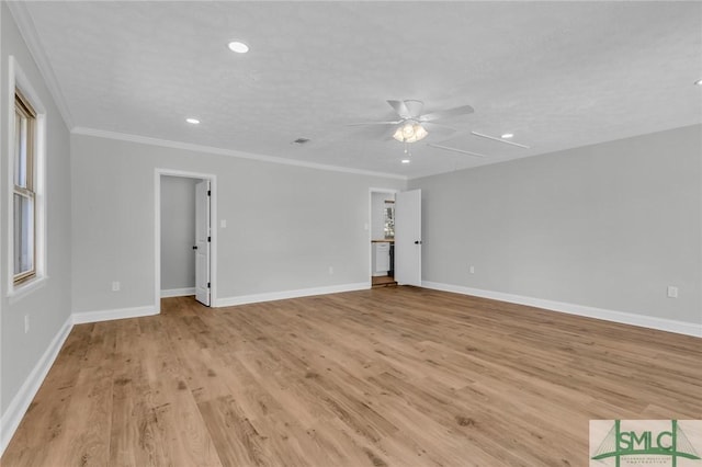 unfurnished room with ceiling fan, baseboards, ornamental molding, and light wood finished floors