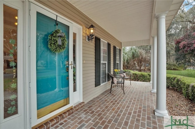 doorway to property with covered porch