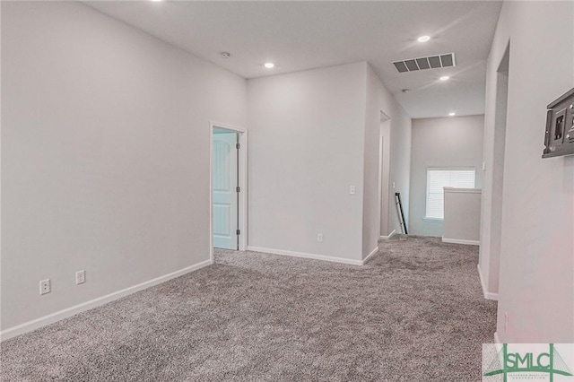 carpeted empty room with visible vents, recessed lighting, and baseboards