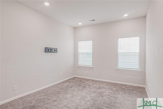 spare room featuring recessed lighting, visible vents, baseboards, and carpet floors