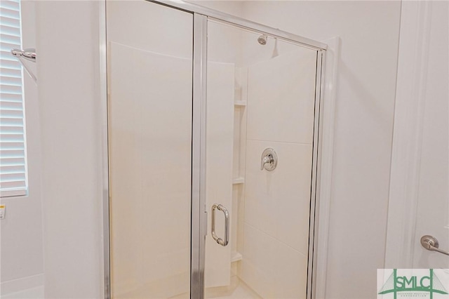 full bathroom featuring a shower stall