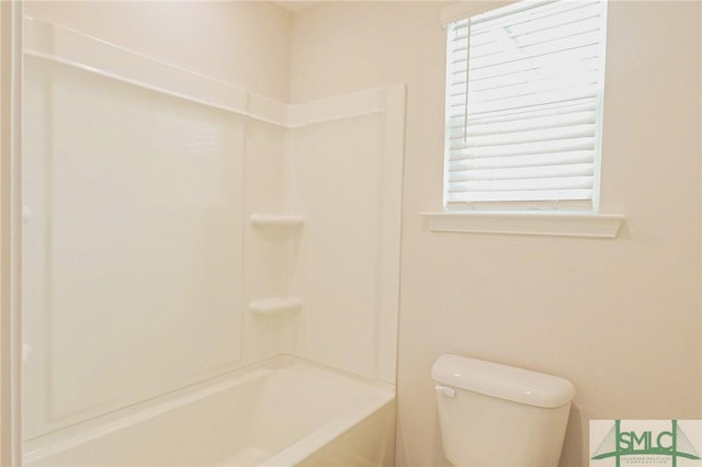 full bathroom featuring toilet and bathing tub / shower combination