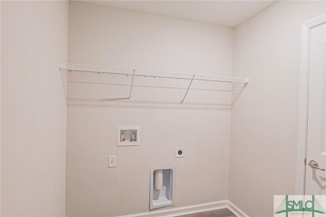 clothes washing area featuring laundry area, electric dryer hookup, baseboards, and washer hookup