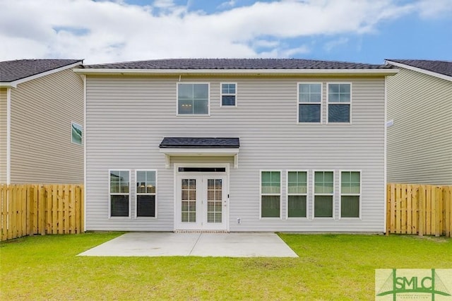 back of property featuring a patio area, a lawn, and a fenced backyard