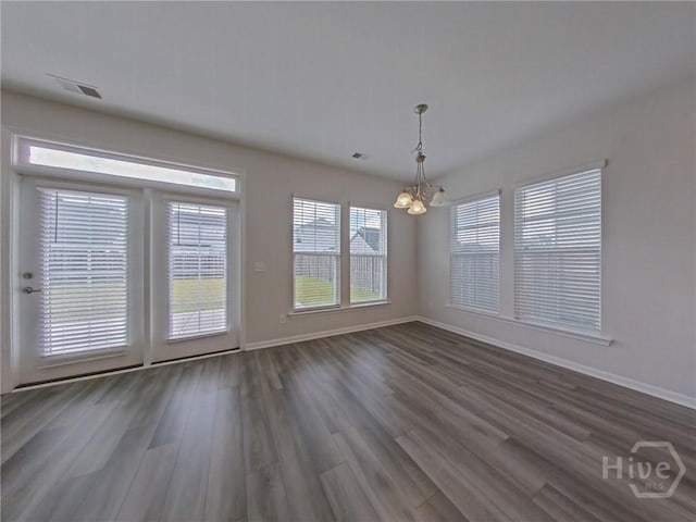 18 Allston Ln, Savannah, GA 31407 - unfurnished dining area with a chandelier, dark wood-style flooring, and baseboards