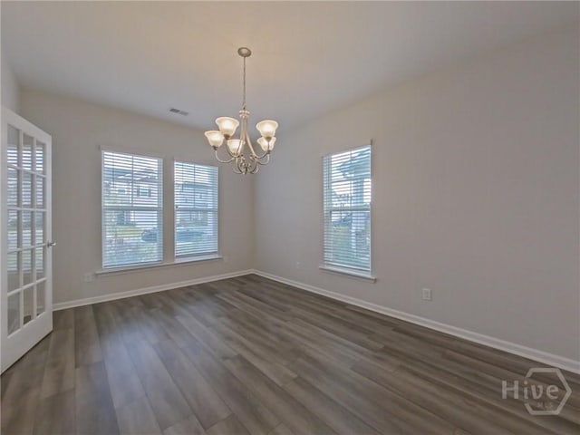 18 Allston Ln, Savannah, GA 31407 - empty room featuring healthy amount of natural light, a chandelier, dark wood-type flooring, and baseboards