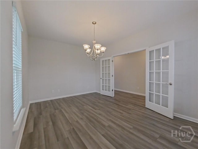 18 Allston Ln, Savannah, GA 31407 - unfurnished dining area featuring french doors, dark wood-style floors, baseboards, and a chandelier