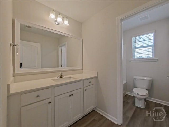 18 Allston Ln, Savannah, GA 31407 - full bath featuring vanity, wood finished floors, toilet, and baseboards