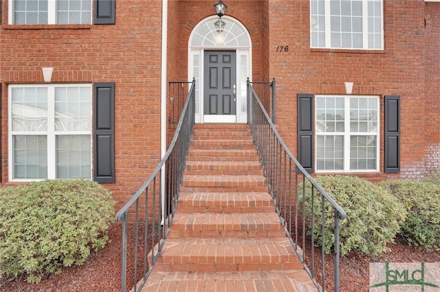 entrance to property with brick siding