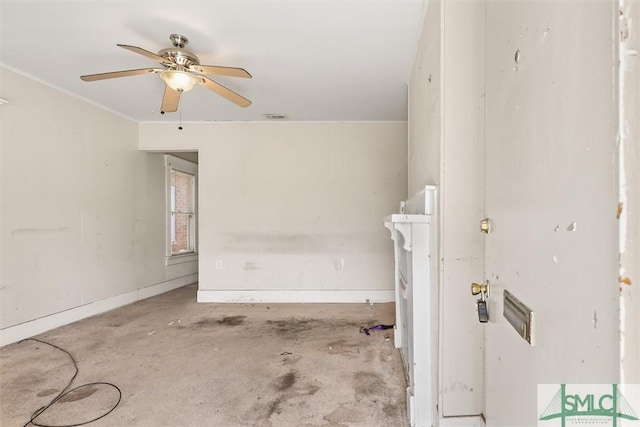 unfurnished room with visible vents, unfinished concrete floors, baseboards, ornamental molding, and a ceiling fan