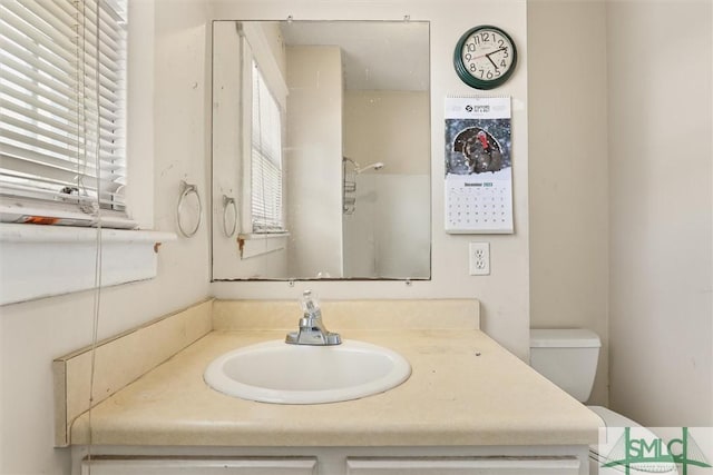 bathroom with vanity and toilet