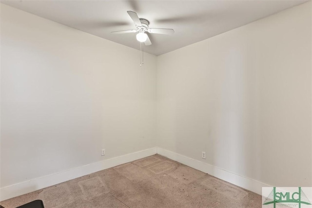 unfurnished room featuring baseboards, light carpet, and ceiling fan