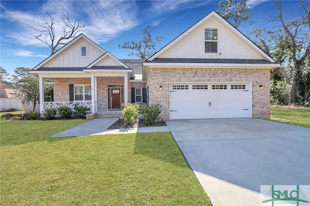 view of front of house with brick siding, board and batten siding, a front yard, covered porch, and driveway