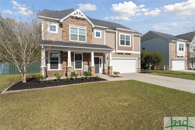 craftsman inspired home featuring driveway, a front lawn, a porch, fence, and an attached garage