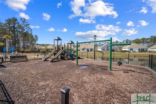 community play area featuring a residential view and fence