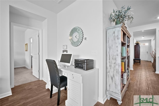 home office with baseboards and wood finished floors