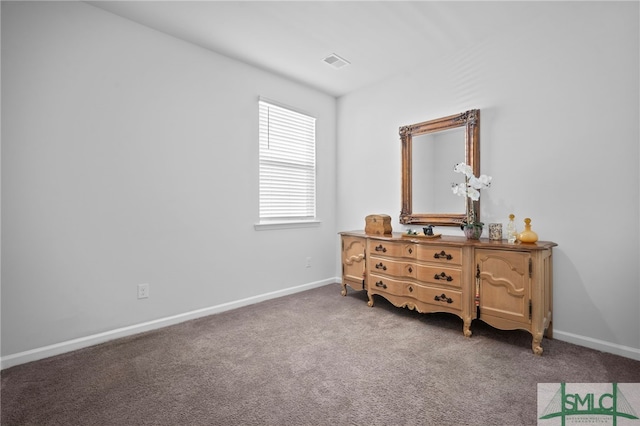 carpeted bedroom with baseboards and visible vents