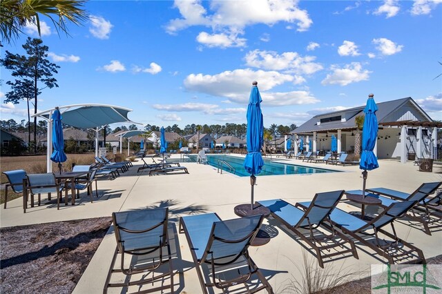 community pool featuring a patio area