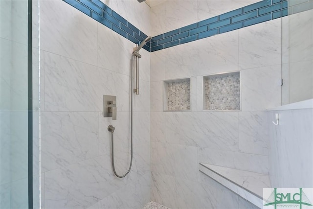 full bathroom with a tile shower