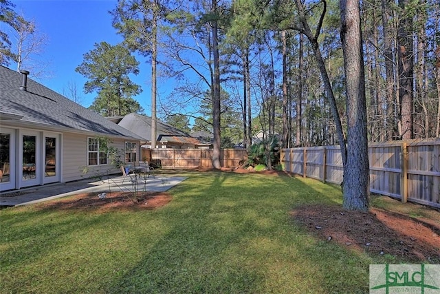 view of yard with a patio and a fenced backyard