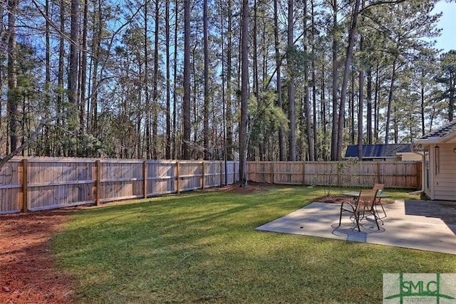 view of yard featuring a patio and a fenced backyard