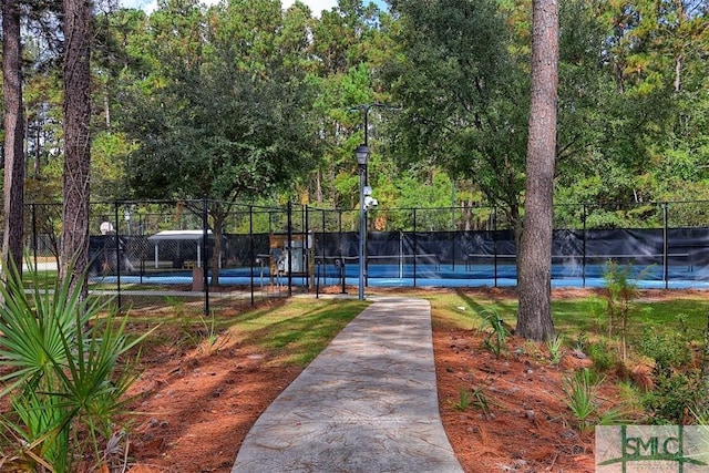 view of sport court with fence