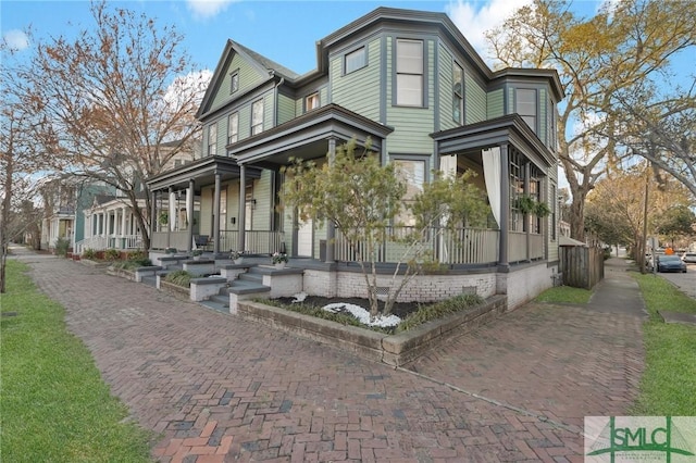 view of property exterior with a porch