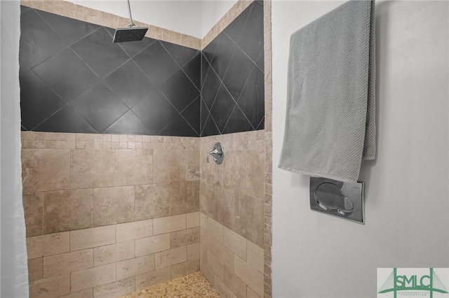 bathroom with tiled shower