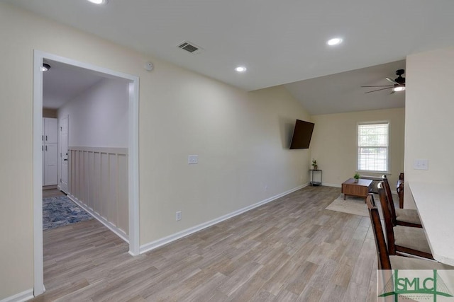 interior space featuring visible vents, recessed lighting, light wood finished floors, ceiling fan, and vaulted ceiling