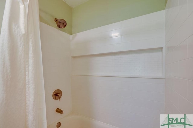 bathroom with shower / bath combination with curtain