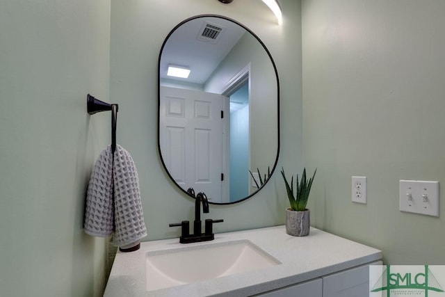 bathroom featuring vanity and visible vents