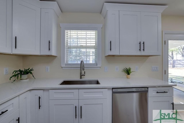 kitchen with white cabinets, dishwasher, a healthy amount of sunlight, and a sink