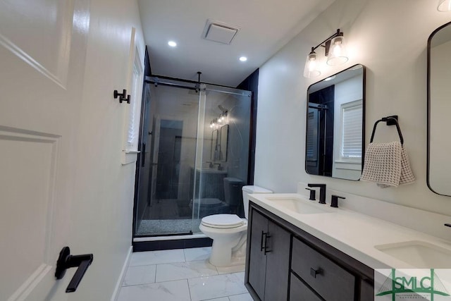 bathroom with a stall shower, toilet, marble finish floor, and a sink