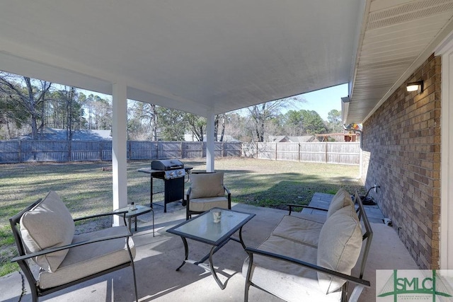 view of patio / terrace with a fenced backyard and a grill