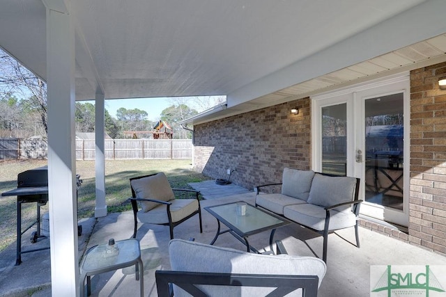 view of patio / terrace with french doors, outdoor lounge area, and fence