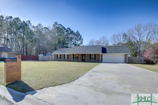 ranch-style home featuring a garage, concrete driveway, a front yard, and fence