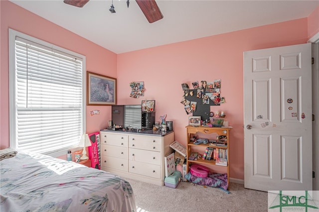 bedroom with a ceiling fan and carpet floors