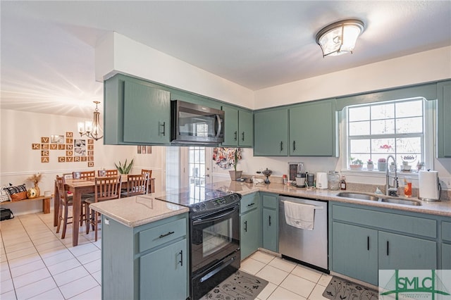 kitchen featuring a sink, appliances with stainless steel finishes, a peninsula, light countertops, and light tile patterned floors