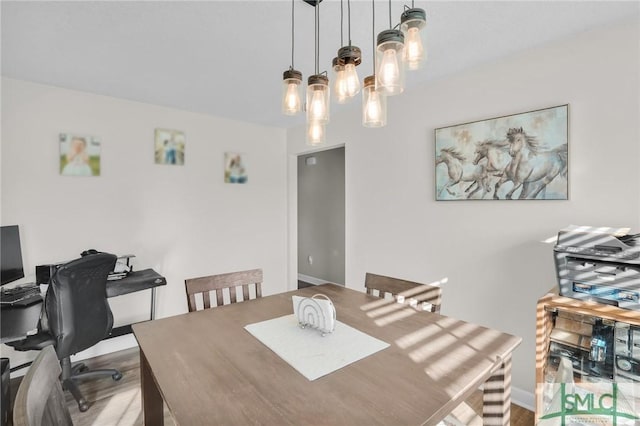 dining room with wood finished floors