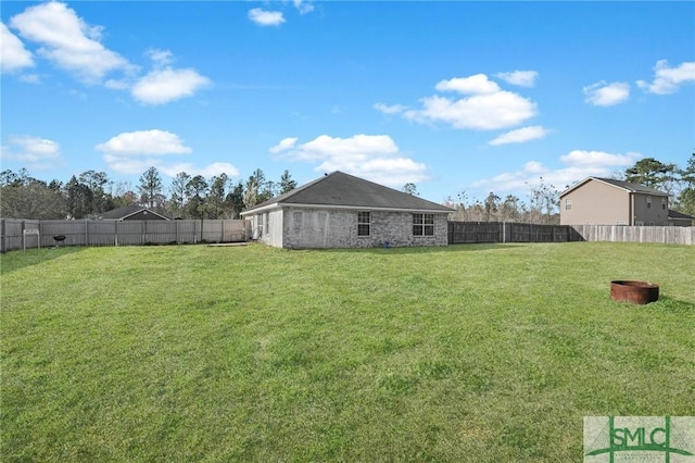 view of yard with a fenced backyard