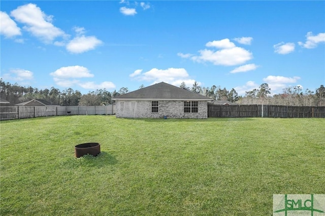 view of yard with a fenced backyard