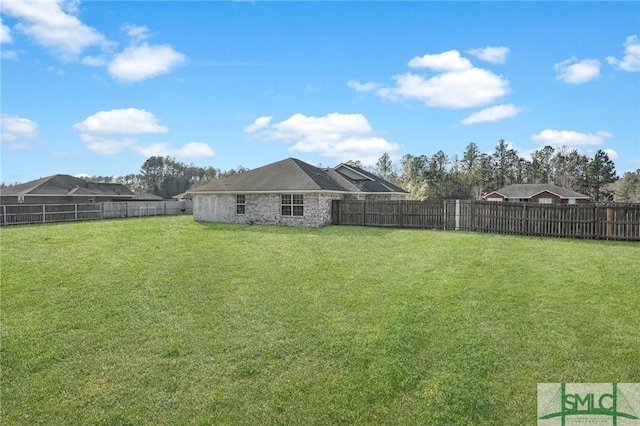 view of yard featuring a fenced backyard