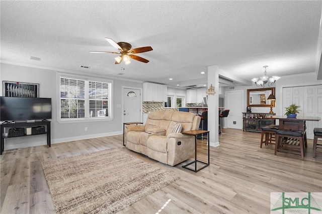 living room featuring crown molding and light wood-style floors