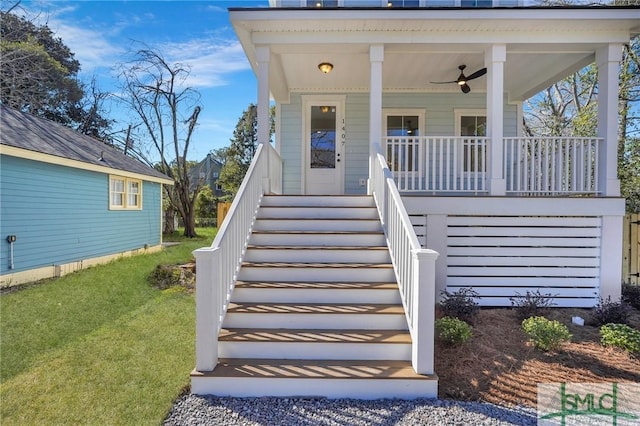 doorway to property featuring a yard and covered porch