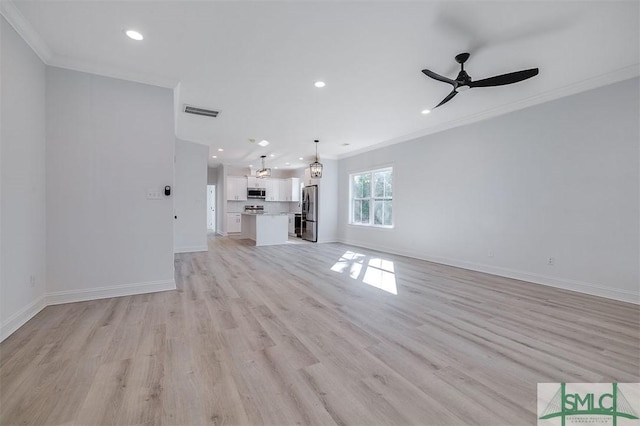 unfurnished living room featuring recessed lighting, light wood-type flooring, baseboards, and ornamental molding