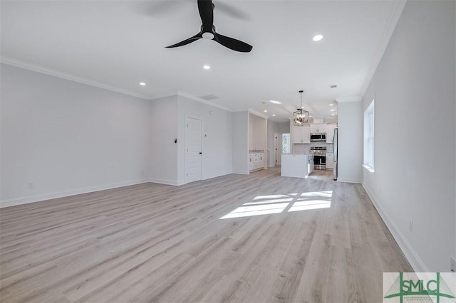 unfurnished living room with recessed lighting, light wood-type flooring, and crown molding