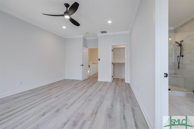 unfurnished bedroom featuring crown molding, baseboards, visible vents, and light wood-type flooring