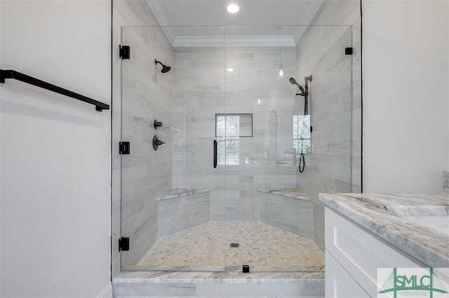 full bath with a stall shower and ornamental molding