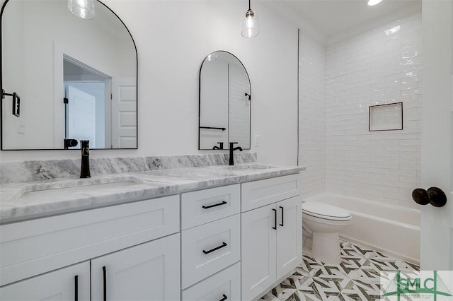 full bath featuring a sink, toilet, double vanity, and shower / tub combination