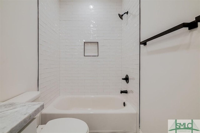 bathroom featuring toilet and  shower combination